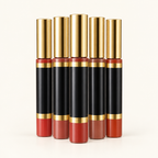 Sealed black and gold LipSense-style lip color wands grouped on an ivory background