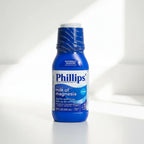 Professional reliable digestive comfort solution blue medicine bottle on white vanity surface with bright natural light