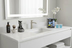 Clean bright bathroom vanity area organized with high-end electric shaver care accessories