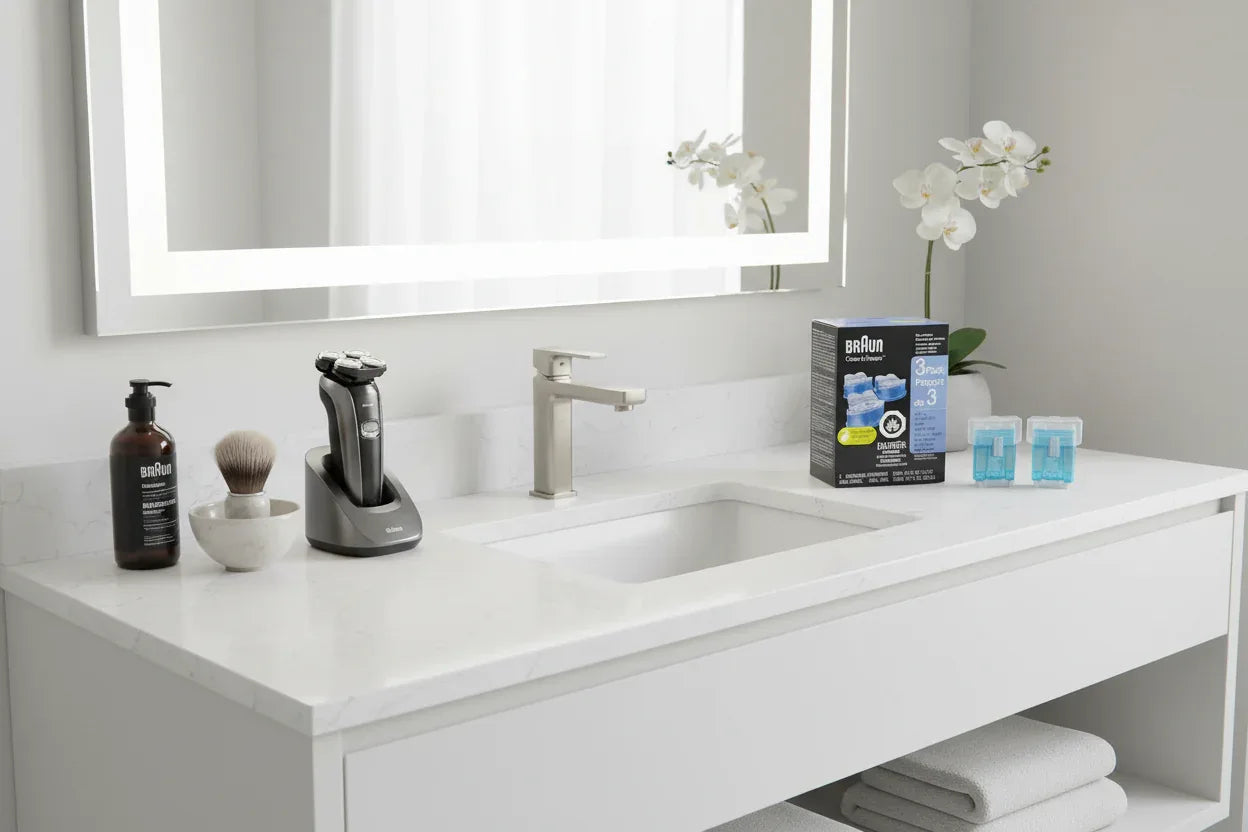 Clean bright bathroom vanity area organized with high-end electric shaver care accessories