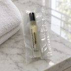 Equivalence Our Equivalence of Megamare Extrait de Parfum sealed vial on a bathroom marble vanity. At least one real product photo taken by Chad is included in the gallery. Remaining images are AI-generated lifestyle photos for visual context only. Minor label or packaging variation may occur between matching stocked units.