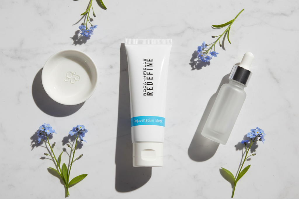 Rodan + Fields REDEFINE Rejuvenation Mask white tube premium flat lay with blue botanical flowers dropper serum and white ceramic dish on marble – More4less Outlet