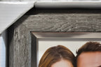 Close-up macro of silver metallic interior trim contrasting with weathered grey wood grain exterior