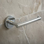 Close-up macro of geometric modern Delta Trinsic chrome bath hardware on a stone wall