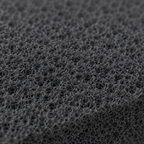 AI-generated macro close-up of the open-cell reticulated foam texture