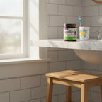 Wellements Organic Multivitamin Gummies on bathroom vanity in morning sunlight with child's toothbrush