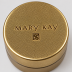 AI-generated close-up of the gold lid of the Mary Kay Satin Lips Lip Balm jar
