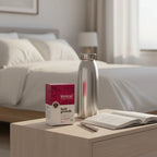 Viviscal Advanced Hair Health box on contemporary bedside table with metal water carafe and open wellness log