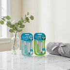 Gillette Venus Extra Smooth razors on marble vanity with eucalyptus and gray towel