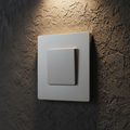 Legrand adorne sofTap switch installed flush in screwless wall plate on dark accent wall