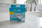 Gillette Venus Smooth 8-count refill blue box on white marble bathroom vanity in soft natural light