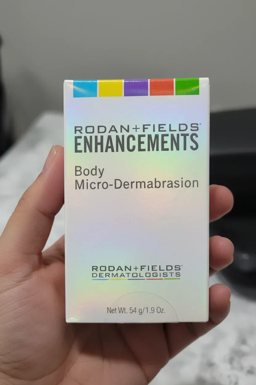 In-hand close-up of Rodan + Fields Body Micro-Dermabrasion premium skincare box