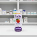 Nutricia Pro-Stat liquid protein medical food purple bottle in clean healthcare dietary aid storage setting on white clinical surface