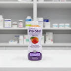 Nutricia Pro-Stat liquid protein medical food purple bottle in clean healthcare dietary aid storage setting on white clinical surface