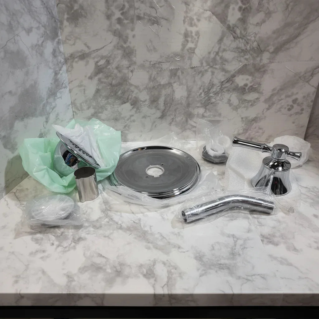 Moen Dartmoor chrome shower trim components studio table shot highlighting polished chrome finish
