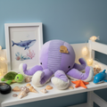 Animal Adventure Purple Octopus Plush on child bedroom shelf with ocean themed decor and seashells - More4less Outlet