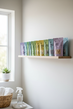 Minimalist shelf with colorful sustainable cleaning refill packets organized neatly