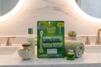 Clean bright bathroom vanity featuring premium women's shaving essentials with green accents