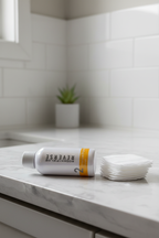Rodan + Fields REVERSE Intensive Brightening Toner bottle on bathroom vanity beside cotton gauze pads