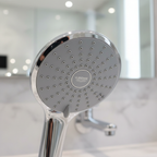 Grohe Euphoria 110 Duo hand shower close-up macro showing StarLight chrome finish and SpeedClean rubber nozzle pattern