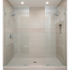 Pfister Arterra chrome shower head in a contemporary walk-in shower with beige porcelain tile and glass enclosure.