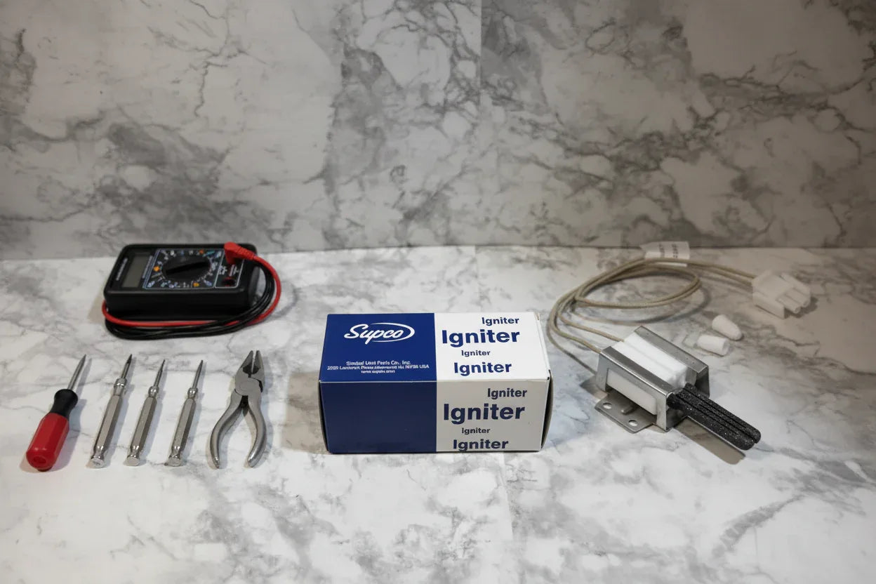 Precision appliance repair tools laid out on marble surface next to oven igniter replacement parts