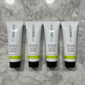 Four Mary Kay Clear Proof Oil-Free Moisturizer tubes standing upright on grey marble - studio shot