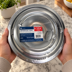 GE GE68C sealed four-pack chrome drip bowls in kitchen setting 4; AI-generated lifestyle illustration