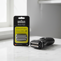 Braun Series 3 ProSkin 32B black shaver head replacement black and yellow retail pack beside compact electric shaver on white marble – More4less Outlet