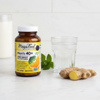 Men's vitamin supplement amber glass bottle beside water glass and fresh ginger root on white marble countertop – More4less Outlet