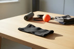 Shock Doctor Flex Ice ankle sleeve on wooden table in natural afternoon light