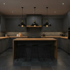 Globe Electric Robin satin black pendant light hanging over modern kitchen island