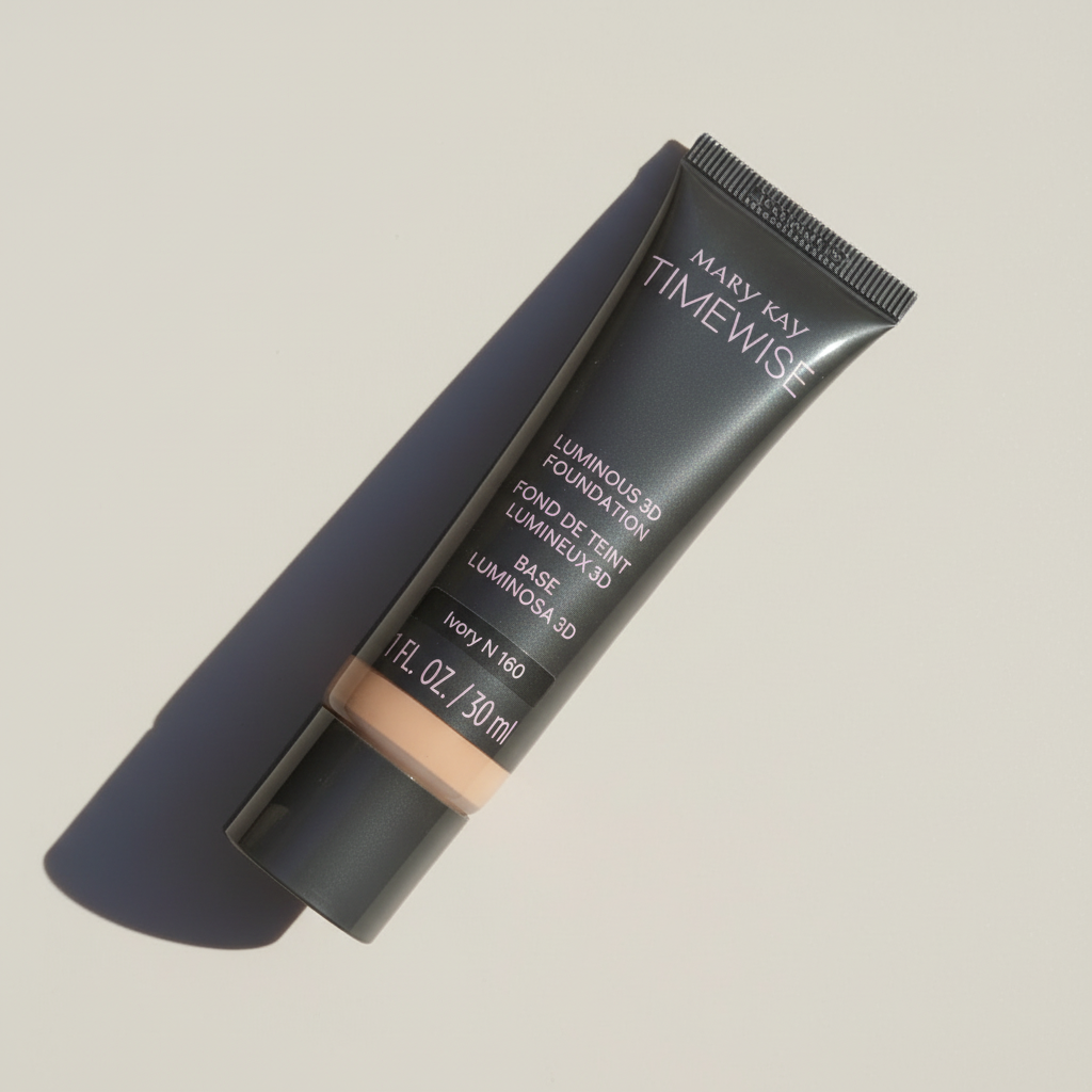 Mary Kay TimeWise Luminous 3D Foundation tube in Ivory N 160 on a pale neutral surface