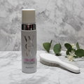 Color Wow Xtra Large Bombshell Volumizer white pump bottle on white marble beside styling brush and botanicals – More4less Outlet