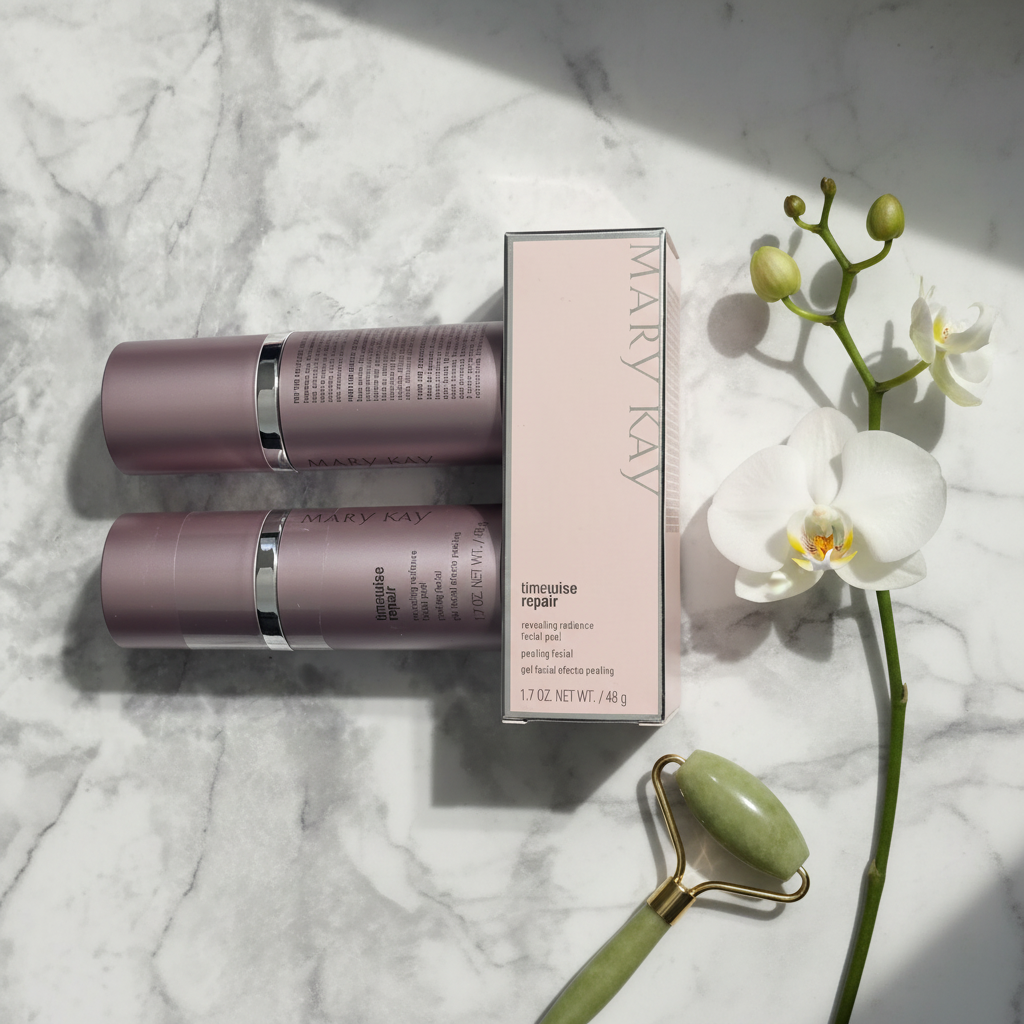 Flat lay of two Mary Kay TimeWise Repair Facial Peel bottles with pink box orchid and jade roller on white marble