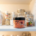 Chewsy Kids Multi jar in organized family health cabinet with clear glass storage jars