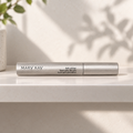 Mary Kay Lash Primer silver tube on a pale shelf in soft morning light