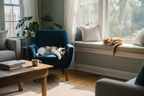 One cat lounging on a windowsill and another resting on an armchair in a peaceful living room