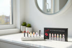 Firstfly transparent color-changing lipsticks arranged on white vanity tray with natural sunlight