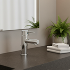 Grohe Concetto chrome faucet on a dark charcoal stone countertop in a luxury spa-style bathroom.