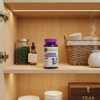 Garden of Life Elderberry Gummies bottle inside organized family health cupboard with soft recessed interior lighting and aesthetic glass wellness containers