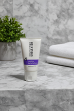 Rodan and Fields UNBLEMISH Invisible Matte Defense SPF 30 sunscreen tube on a marble bathroom counter with soft natural light and a small green plant – More4less Outlet