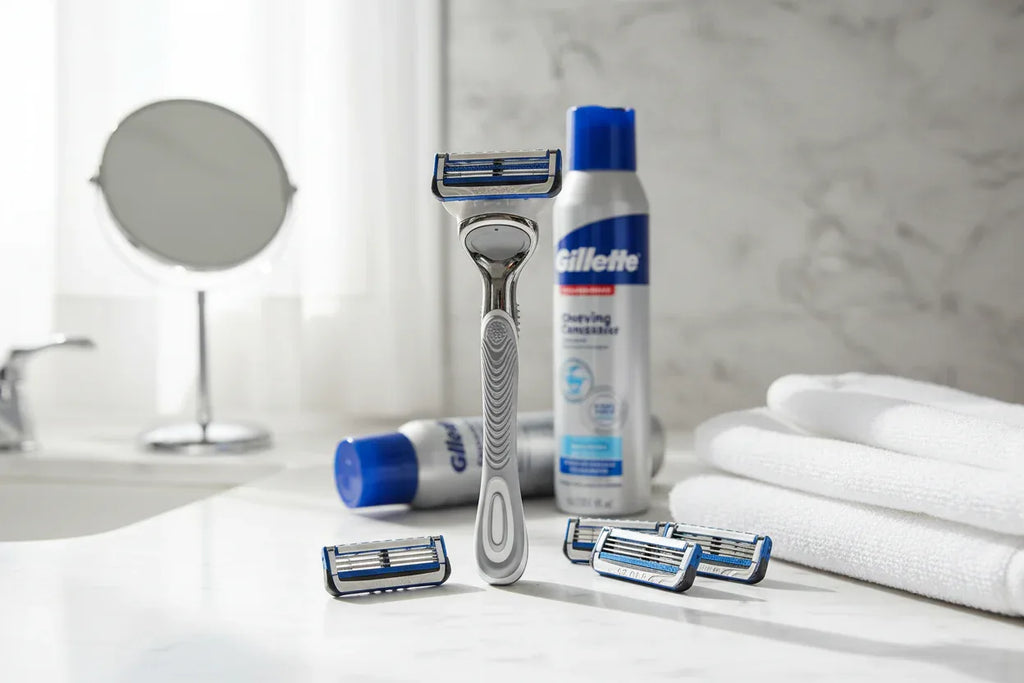 Gillette SkinGuard Sensitive razor on marble bathroom counter with shaving cream lifestyle