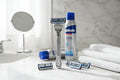 Gillette SkinGuard Sensitive razor on marble bathroom counter with shaving cream lifestyle