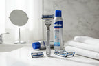 Gillette SkinGuard Sensitive razor on marble bathroom counter with shaving cream lifestyle