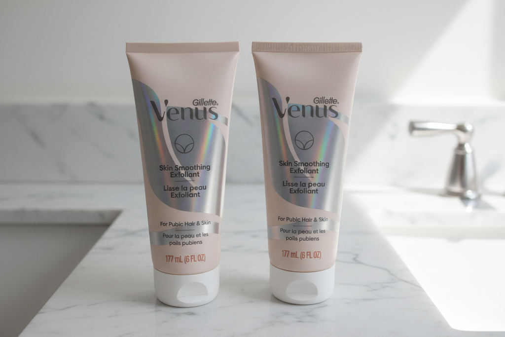 Two Gillette Venus Skin Smoothing Exfoliant 6oz tubes side by side on white marble bathroom vanity in soft natural light
