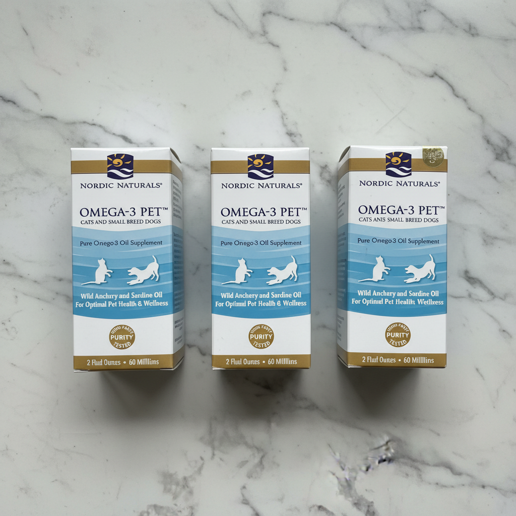 Three Nordic Naturals Omega-3 Pet supplement boxes arranged on white marble surface, 3-pack flat lay
