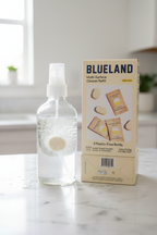 Sustainable multi-surface cleaning tablet dissolving in spray bottle on white marble countertop
