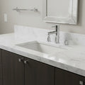 American Standard Serin chrome faucet on contemporary bathroom vanity with white marble lifestyle image