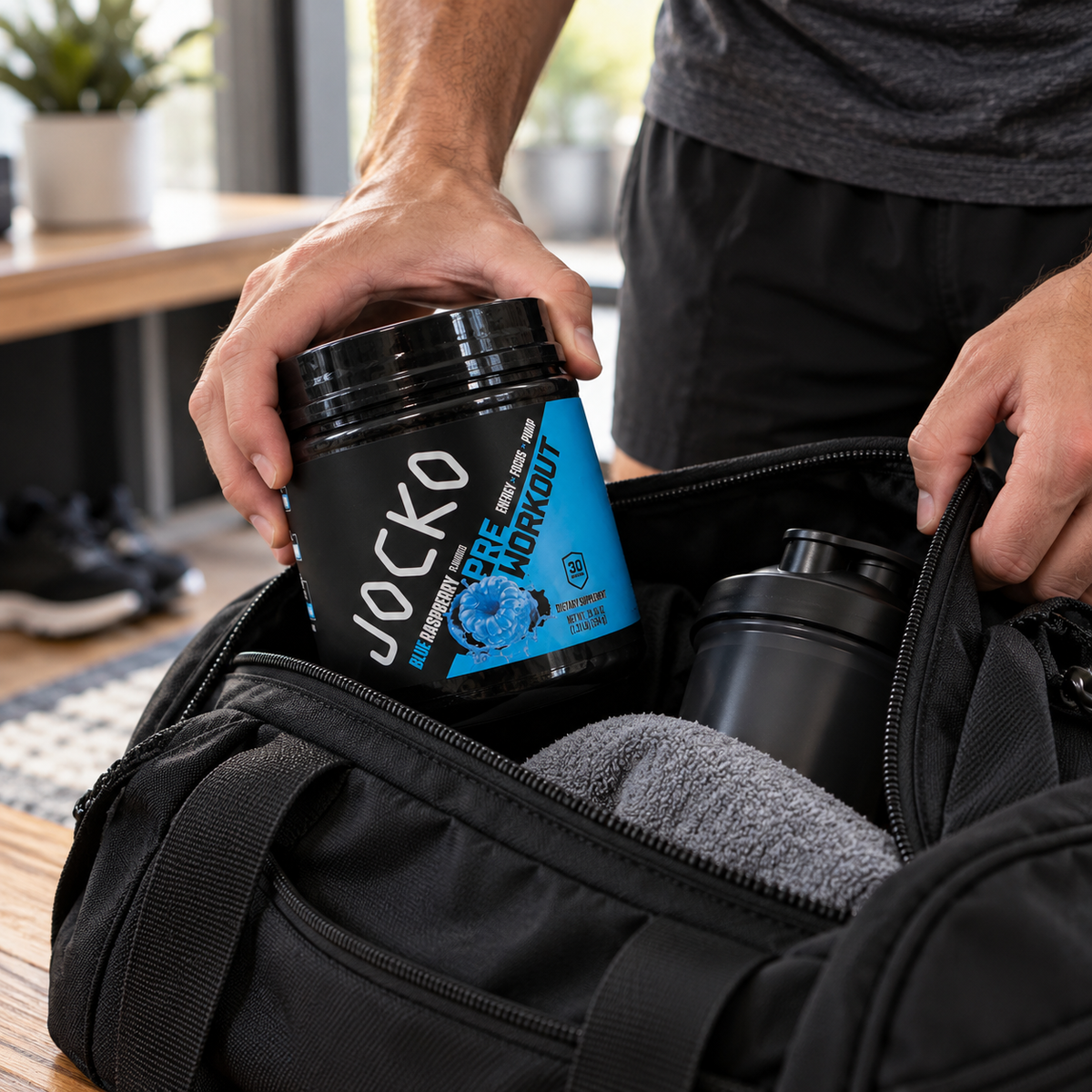 Packing Jocko Blue Raspberry Pre-Workout in a gym bag